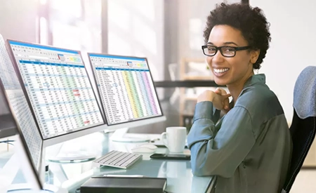 woman at computer looking at billing