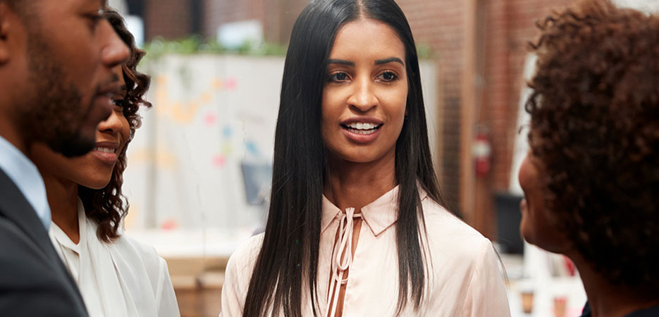 women and a man communicating