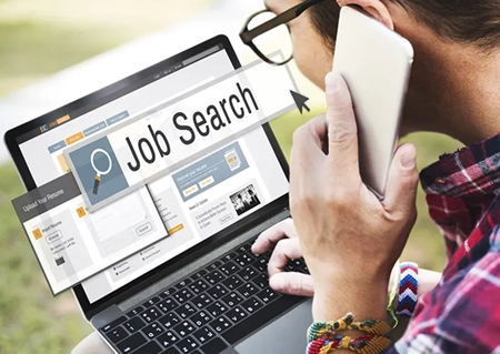 woman with laptop looking for a job