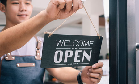 Woman with open sign